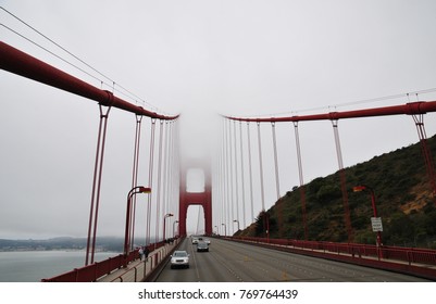 Uncommon wide-angle view of Golden Gate Bridge captured on a typical foggy day, San Francisco, California, USA