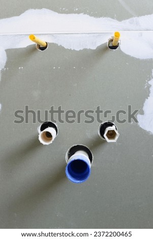 unconnected pipes in a wall renovation material utensils