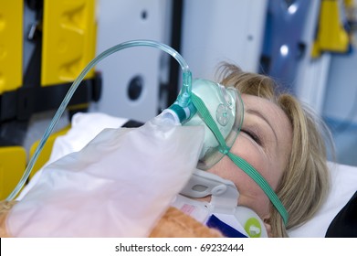 Unconscious Woman With Oxygen Mask, Ambulance Interior