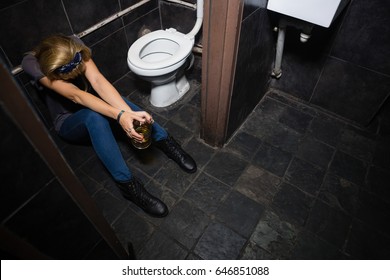 Unconscious woman sleeping in the washroom - Powered by Shutterstock