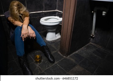 Unconscious woman sleeping in the washroom - Powered by Shutterstock