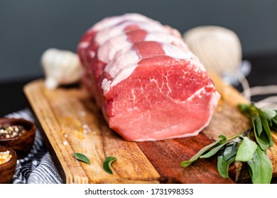 Uncooked Boneless Pork Roast On The Cutting Board.