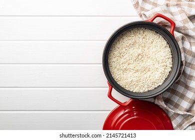 Uncooked Carnaroli risotto rice in a pot. Top view. - Shutterstock ID 2145721413
