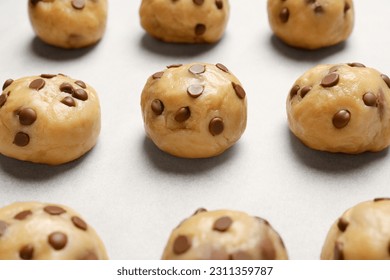 Uncooked chocolate chip cookies on table, closeup - Powered by Shutterstock