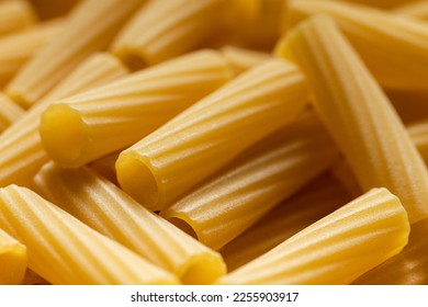 Uncooked dry pasta. Food background. Close up of noodles. - Powered by Shutterstock