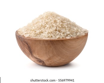  Uncooked dry rice in wooden bowl isolated on white - Shutterstock ID 556979941