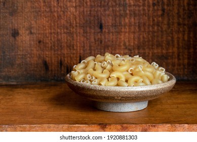 Uncooked Elbow Noodles In A Bowl