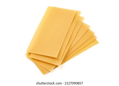 Uncooked lasagna pasta isolated on white background. High resolution image - Powered by Shutterstock