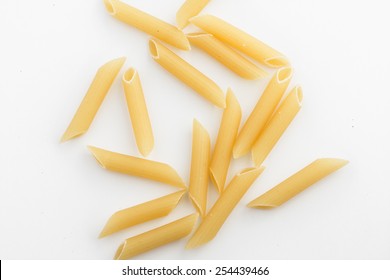 Uncooked Penne Pasta Isolated On White Background