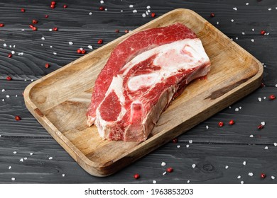 Uncooked Raw Beef Brisket On Wooden Board