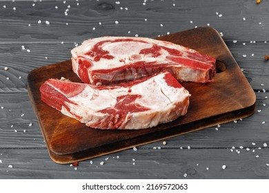 Uncooked Raw Beef Brisket On Wooden Board