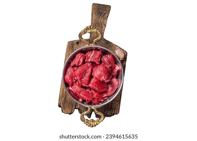 Uncooked Raw diced beef veal meat for stew in skillet. Isolated, white background