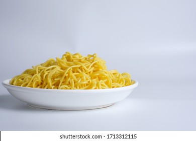 Uncooked Raw Egg Yellow Noodles Isolated On White Background.