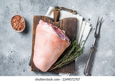 Uncooked Raw pork ham hocks, shanks on a wooden board with spices. Gray background. Top view. - Shutterstock ID 2249072707