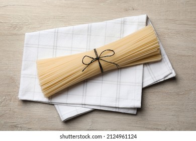 Uncooked Rice Noodles With Napkin On Wooden Table, Top View