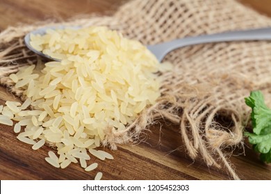 Uncooked Rice On A Spoon