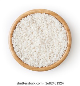 Uncooked round rice in wooden bowl isolated on white background with clipping path