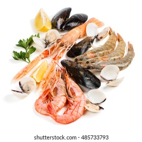 Uncooked Seafood (langoustine,  Shrimp,  Shellfish,  Mussel,  Clam) Decorated With Lemon And Parsley Isolated On White Background.