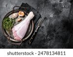 Uncooked turkey legs Drumsticks, raw Poultry meat. Black background. Top view. Copy space.