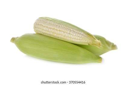 uncooked white corn with leaf on white background