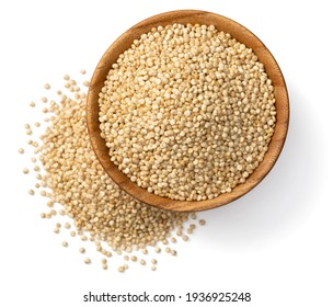 uncooked white quinoa seeds, in the wooden bowl, isolated on pure white background, top view