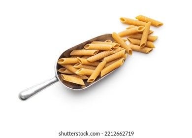 Uncooked whole grain pasta isolated on the white background. Raw penne pasta in scoop. - Shutterstock ID 2212662719