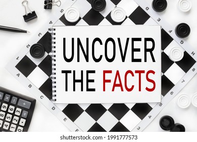 Uncover The Facts. Notebook On A Chessboard, Checkers White And Black