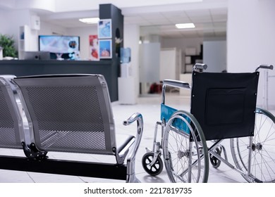 Uncrowded Waiting Room Of Empty Sanatorium With Chairs And Seats For People Of All Abilities. Userless Wheelchair In Unused Lobby Of Empty Hospital. Patient Waiting Area With No One To Be Seen.