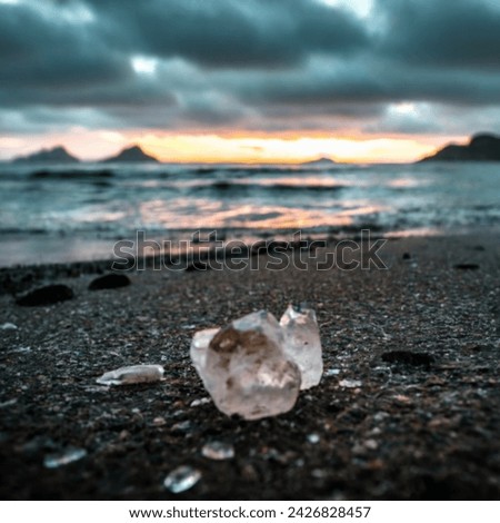 Uncut gem precious stone on the beach side