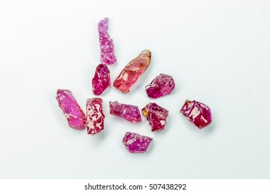 Uncut Pink Sapphire Gems On The White Background.