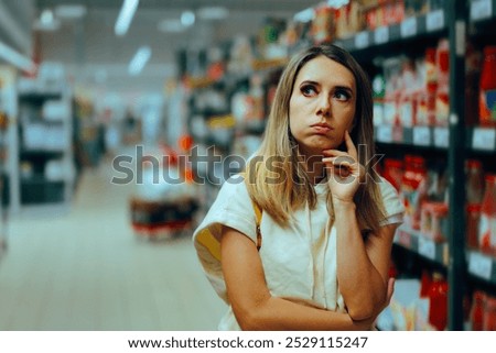 
Undecided Customer Thinking What to Buy in Supermarket. Woman in doubt thinking about price inflation and consumerism 
