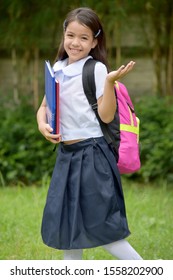 An Undecided Student Child With Books