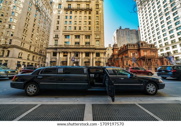 Undefined Luxury limousine open door for prepare\
service vip customer at Philadelphia city in down town with\
historic building, Pennsylvania, Architecture and building, Travel\
and Tourism concept