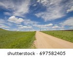 Under the blue sky and white clouds, the road on the prairie of Hulun Buir