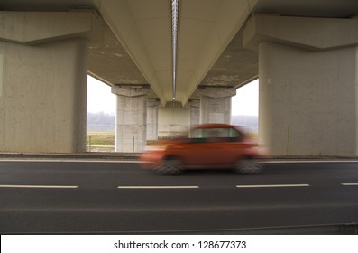 under the bridge with a car