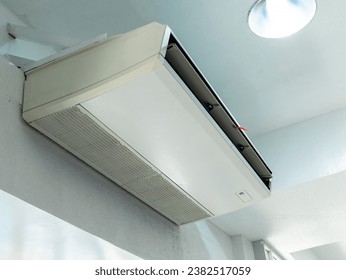 An Under Ceiling Inverter - Split Type Air Conditioner, also known as a ceiling suspended type AC, mounted in an exhibit room.