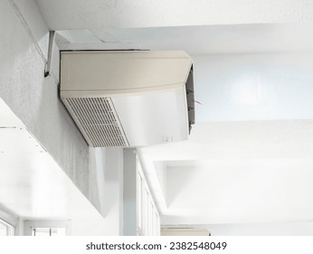 An Under Ceiling Inverter - Split Type Air Conditioner, also known as a ceiling suspended type AC, mounted in an exhibit room.
