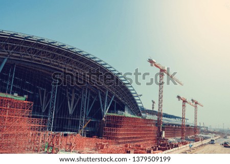 Under construction of metal steel framework outdoors buildings with crane, metal steel framework of bridge construction, the concept of under construction.