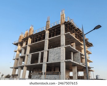Under construction residential building with Concreate Block or bricks structure. Exterior view of highrise under construction building with modern design, under construction skyscraper, G+8 building.