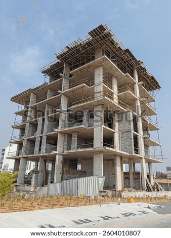 Under construction residential building with Concreate Block or bricks structure. Exterior view under construction building with erected Scaffolding with Modern Design
G+6 floor building