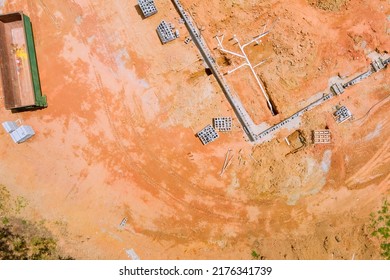 Under The Foundation Of A New Residential Construction Home, Sewer And Water Pipes Are Laid In The Ground In Construction Site