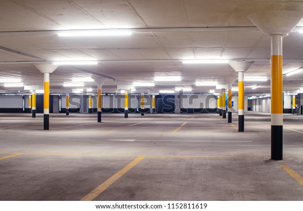 Under ground\
empty, illuminated car park floor\
