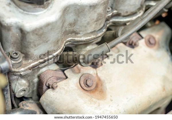 Under the hood of the car are the\
connected armored wires of the gasoline engine spark\
plug.