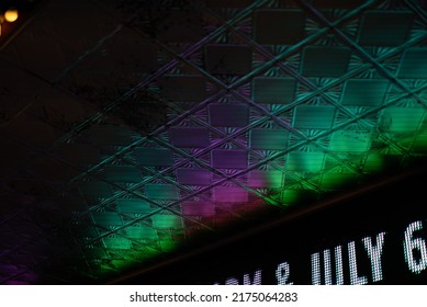 Under Lighting Stringed Light Bulbs Under Theatre Awning With Neon On The Side Of Roof. Tin Ceiling Tiles. Metal Stamped Tin Tile Under Roof On The Ceiling.