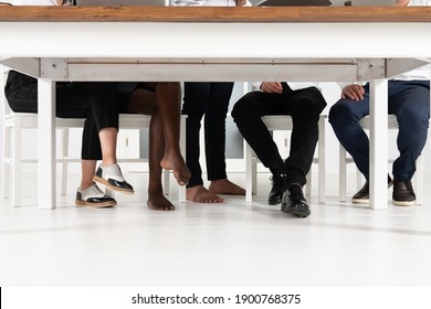 Under The Table Shot At Business Meeting, Bare Feet. Business People Legs Under The Office Table While They Are Working