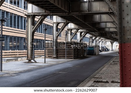 Under the train bridge next to the parking garage in Berlin.