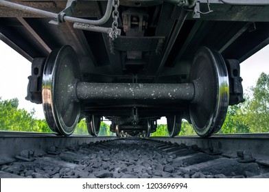 Under The Train. Super Wide Angle, Perspective Lines. Railway Background. Freight Train, Railroad Theme. Transporting System, Cargo Service. Set Of Wheels. High Speed Train. Travel And Adventures