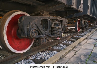 Under The Train. Super Wide Angle, Perspective Lines. Railway Background. Freight Train, Railroad Theme. Transporting System, Cargo Service. Set Of Wheels. High Speed Train. Travel And Adventures 