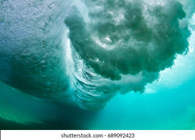 under water scene, crashing wave in turquoise blue water - Powered by Shutterstock