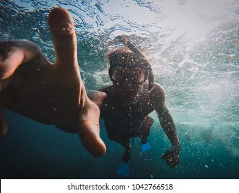 Under Water Shot Using A Gopro While Snorkeling In Action Splashing Water Reaching Hand Diving Swimming During Holidays Vacation Adventure Movement Of A Person In The Ocean Sea Pool.